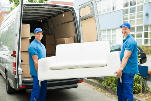 Packed moving boxes and furniture ready for collection