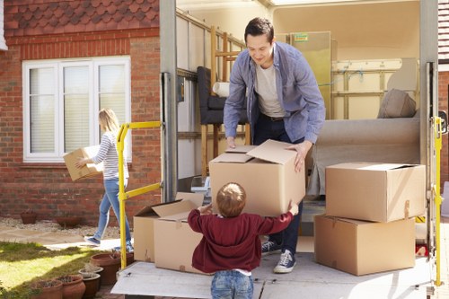 Man With Van Brixton moving boxes and furniture in a local residential street