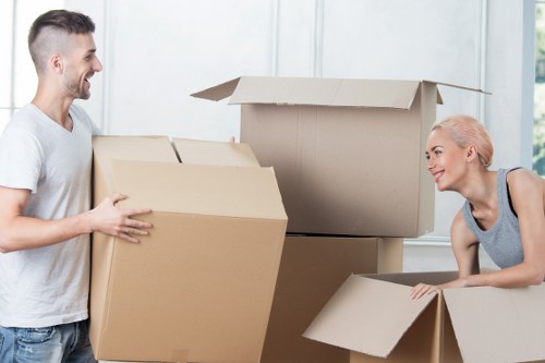 Trained moving staff preparing furniture with careful handling