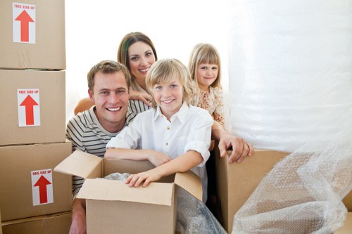 Careful loading of household items for a move in Brixton