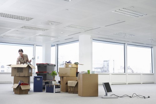 Packed boxes and office items ready for commercial relocation in Brixton