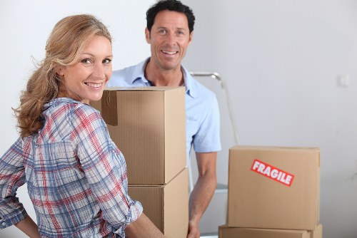 Selection of moving cartons, tape, and wrapping supplies for a Brixton move