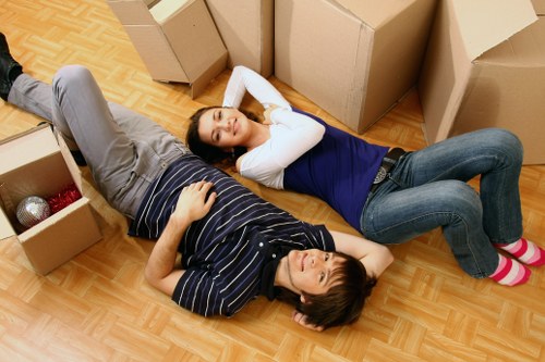 Business relocation team preparing IT and office items for transport in Brixton